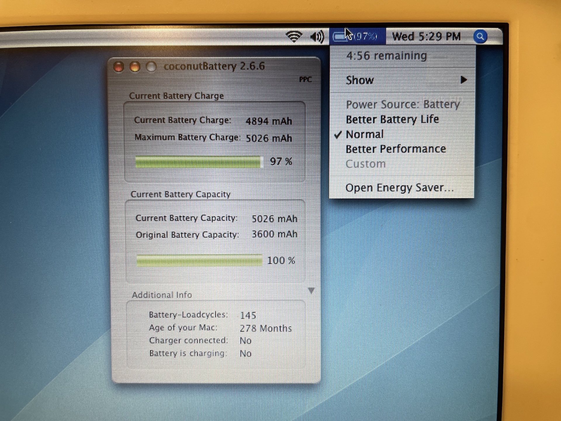 Photo of an iBook screen showing coconutBattery and the estimated runtime of 4 hours and 56 minutes